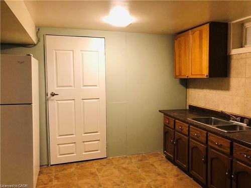 Basement-357 Mohawk Road W, Hamilton, ON - Indoor Photo Showing Kitchen With Double Sink