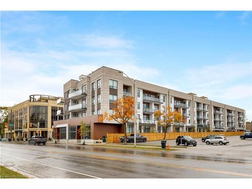 307-123 Maurice Drive, Oakville, ON - Outdoor With Balcony With Facade