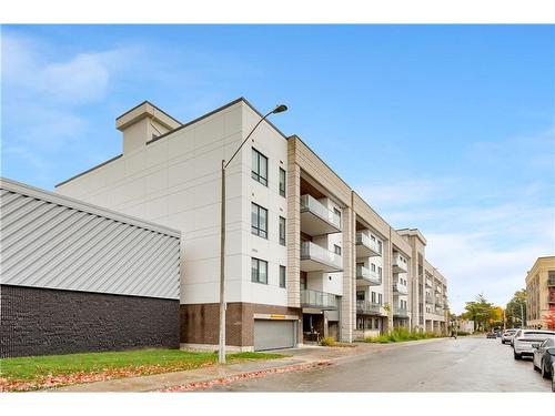 307-123 Maurice Drive, Oakville, ON - Outdoor With Balcony With Facade