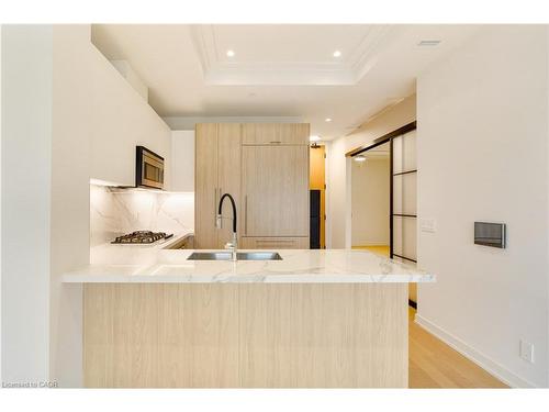 307-123 Maurice Drive, Oakville, ON - Indoor Photo Showing Kitchen With Double Sink