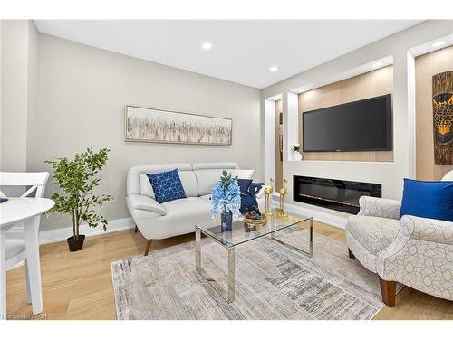150 Brucedale Avenue E, Hamilton, ON - Indoor Photo Showing Living Room With Fireplace