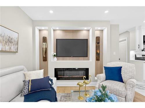 150 Brucedale Avenue E, Hamilton, ON - Indoor Photo Showing Living Room With Fireplace
