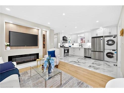 150 Brucedale Avenue E, Hamilton, ON - Indoor Photo Showing Living Room With Fireplace