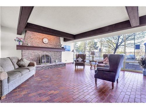 809-225 Harvard Place, Waterloo, ON - Indoor Photo Showing Living Room With Fireplace
