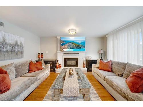 22 Caswell Drive, Hamilton, ON - Indoor Photo Showing Living Room With Fireplace