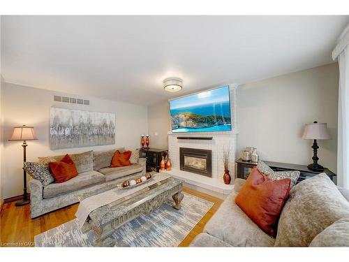 22 Caswell Drive, Hamilton, ON - Indoor Photo Showing Living Room With Fireplace