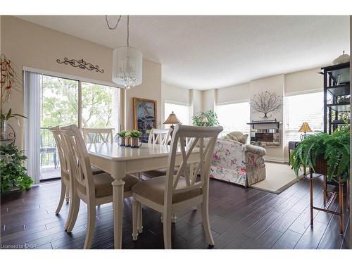 305-3497 Upper Middle Road, Burlington, ON - Indoor Photo Showing Dining Room With Fireplace