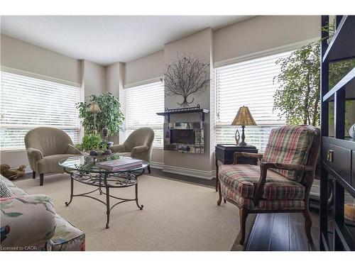 305-3497 Upper Middle Road, Burlington, ON - Indoor Photo Showing Living Room With Fireplace