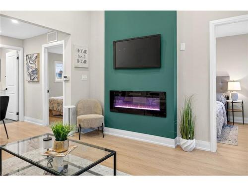 156 Walter Avenue N, Hamilton, ON - Indoor Photo Showing Living Room With Fireplace