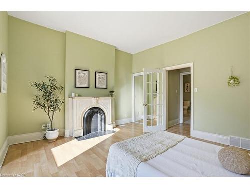 24 Florence Street, Hamilton, ON - Indoor Photo Showing Bedroom With Fireplace