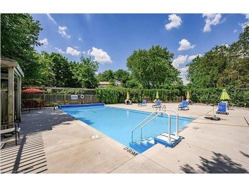 405-89 Westwood Road, Guelph, ON - Outdoor With In Ground Pool With Backyard