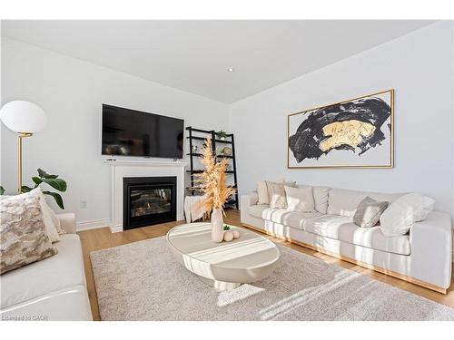 66 Cesar Place, Ancaster, ON - Indoor Photo Showing Living Room With Fireplace
