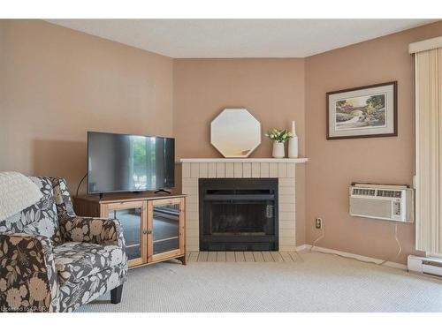 921-1450 Glen Abbey Gate, Oakville, ON - Indoor Photo Showing Living Room With Fireplace