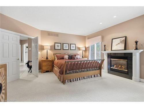 7 Appaloosa Trail, Carlisle, ON - Indoor Photo Showing Bedroom With Fireplace