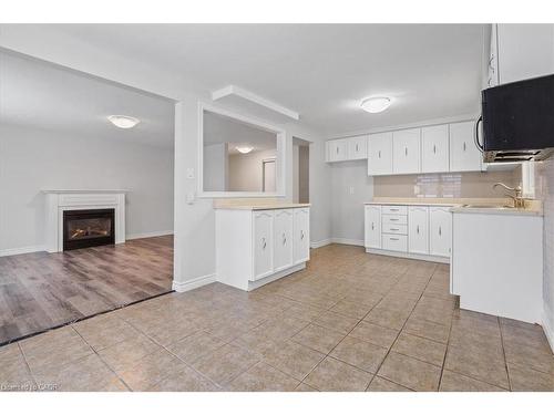 67 Old Carriage Drive, Kitchener, ON - Indoor Photo Showing Kitchen With Fireplace