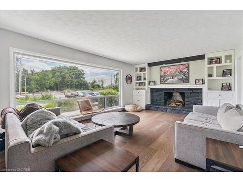 1099 Burnhamthorpe Road W, Oakville, ON - Indoor Photo Showing Living Room With Fireplace