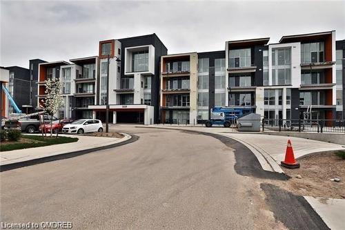 415-3028 Creekshore Common, Oakville, ON - Outdoor With Balcony With Facade