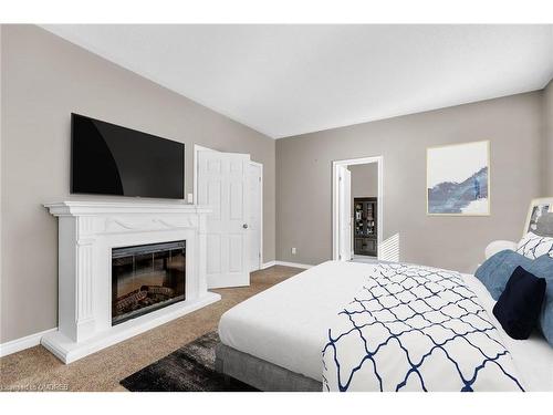 24933 Pioneer Line, West Lorne, ON - Indoor Photo Showing Bedroom With Fireplace