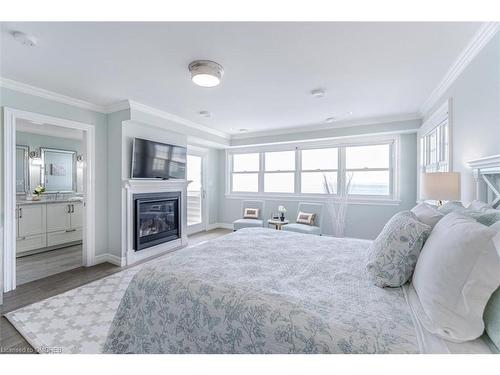 35 Promenade Way, Fort Erie, ON - Indoor Photo Showing Bedroom With Fireplace