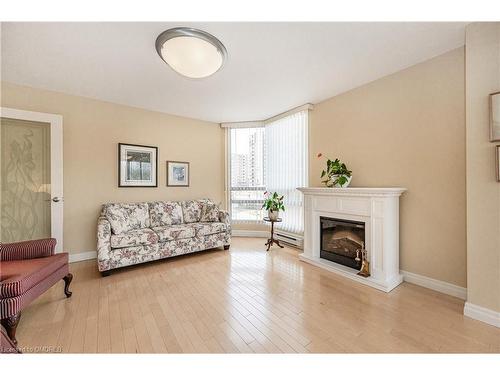 201-2170 Marine Drive, Oakville, ON - Indoor Photo Showing Living Room With Fireplace