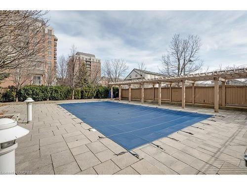 103-2365 Central Park Drive, Oakville, ON - Outdoor With In Ground Pool With Backyard
