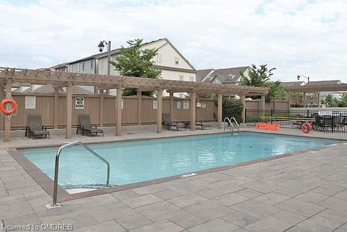 103-2365 Central Park Drive, Oakville, ON - Outdoor With In Ground Pool With Deck Patio Veranda