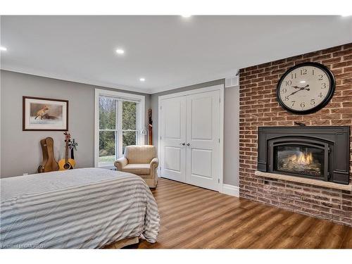 208 Ski Hill Road, Bethany, ON - Indoor Photo Showing Bedroom With Fireplace