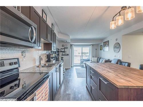 301-25 Kay Crescent, Guelph, ON - Indoor Photo Showing Kitchen With Double Sink