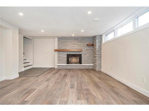Lower-4 Sandra Court, Hamilton, ON - Indoor Photo Showing Living Room With Fireplace