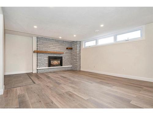 Lower-4 Sandra Court, Hamilton, ON - Indoor Photo Showing Other Room With Fireplace