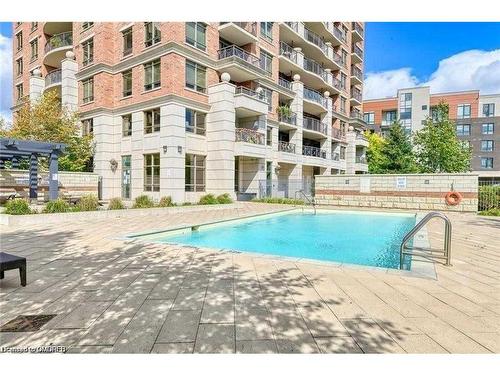 1104-2379 Central Park Drive, Oakville, ON - Outdoor With In Ground Pool With Balcony With Facade