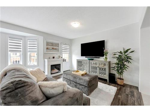 583 Speyer Circle, Milton, ON - Indoor Photo Showing Living Room With Fireplace