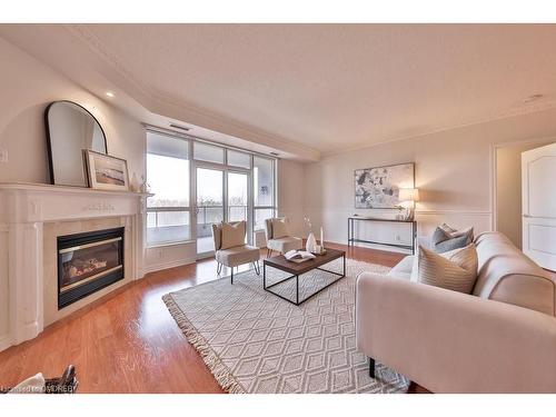 607-1900 The Collegeway, Mississauga, ON - Indoor Photo Showing Living Room With Fireplace
