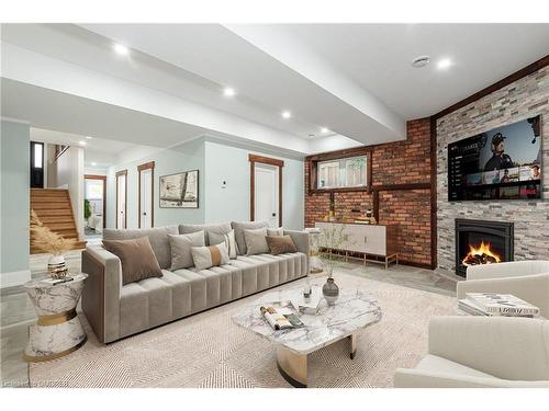 20 Tasker Street, St. Catharines, ON - Indoor Photo Showing Living Room With Fireplace
