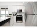 905-450 Dundas Street E, Waterdown, ON  - Indoor Photo Showing Kitchen With Stainless Steel Kitchen With Double Sink 