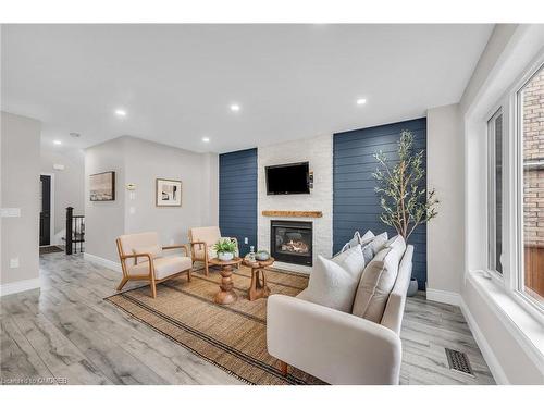 573 Baldwin Crescent, Woodstock, ON - Indoor Photo Showing Living Room With Fireplace