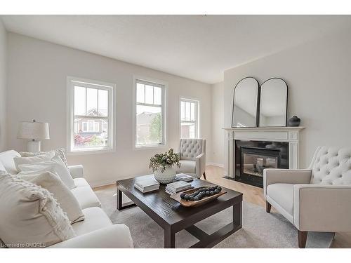 293 Goutouski Crescent, Milton, ON - Indoor Photo Showing Living Room With Fireplace