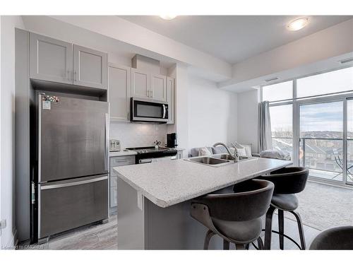 509-450 Dundas Street E, Waterdown, ON - Indoor Photo Showing Kitchen With Stainless Steel Kitchen With Double Sink