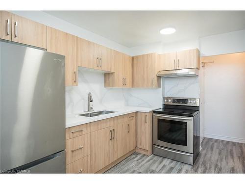 508-390 Dixon Road, Toronto, ON - Indoor Photo Showing Kitchen With Double Sink