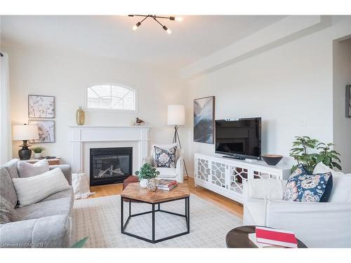 166 Manley Lane, Milton, ON - Indoor Photo Showing Living Room With Fireplace