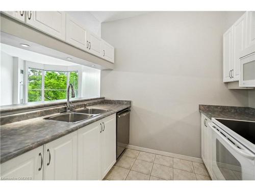 204-2511 Lakeshore Road W, Oakville, ON - Indoor Photo Showing Kitchen With Double Sink