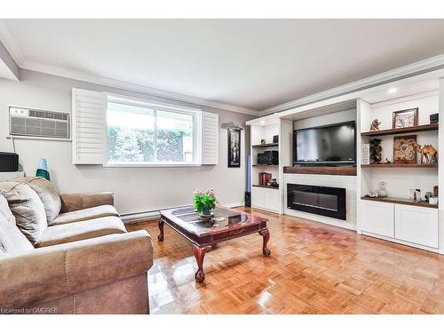 104-482 James Street N, Hamilton, ON - Indoor Photo Showing Living Room With Fireplace