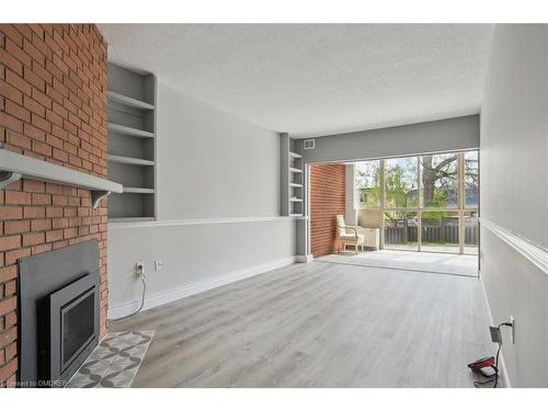 102-162 Reynolds Street, Oakville, ON - Indoor With Fireplace