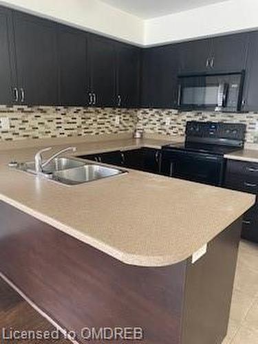 1-2563 Sixth Line, Oakville, ON - Indoor Photo Showing Kitchen With Double Sink