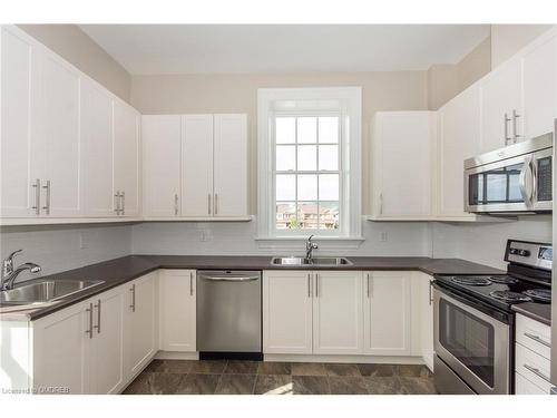 208-33 Whitmer Street, Milton, ON - Indoor Photo Showing Kitchen With Double Sink