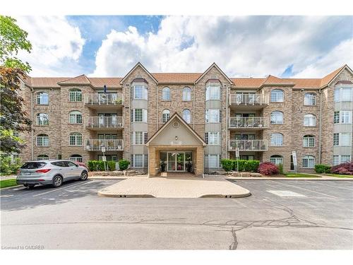 101-216C Plains Road W, Burlington, ON - Outdoor With Balcony With Facade