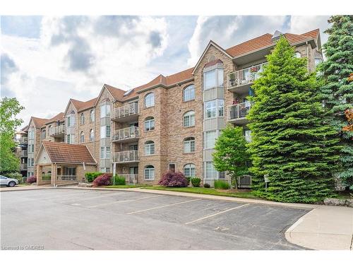 101-216C Plains Road W, Burlington, ON - Outdoor With Balcony With Facade