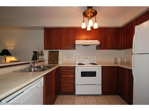 103-2300 Parkhaven Boulevard, Oakville, ON - Indoor Photo Showing Kitchen With Double Sink
