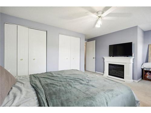 77 Elma Place, Cambridge, ON - Indoor Photo Showing Bedroom With Fireplace