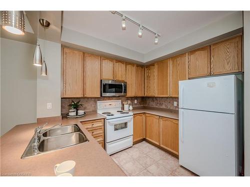 302-80 Port Street E, Mississauga, ON - Indoor Photo Showing Kitchen With Double Sink
